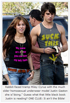 Rabbit-faced tramp Miley Cyrus with the much older homosexual underwear model Justin Gaston she is "doing." Gues what that little black book Just is reading? ONE CLUE: It ain't the Bible!
